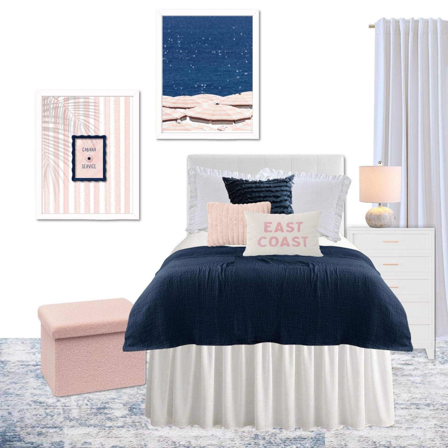 Cabana coastal dorm decor with ruffle bedding, navy and blush pink accents, and framed artwork on a white wall.