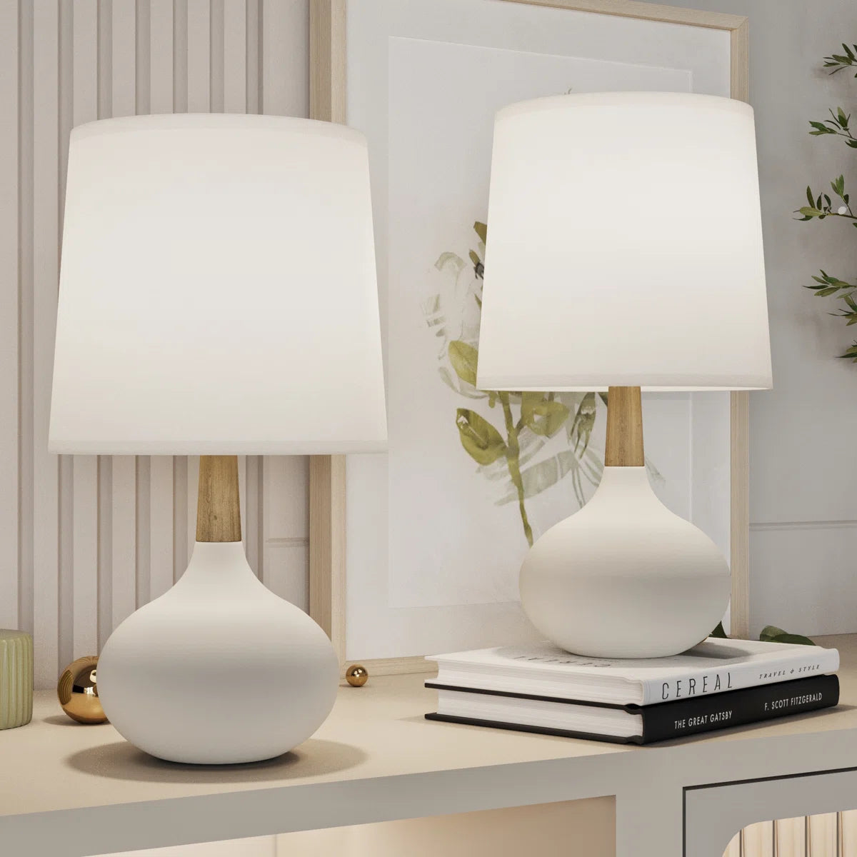 Two modern white and wood table lamps styled on a neutral dorm desk.