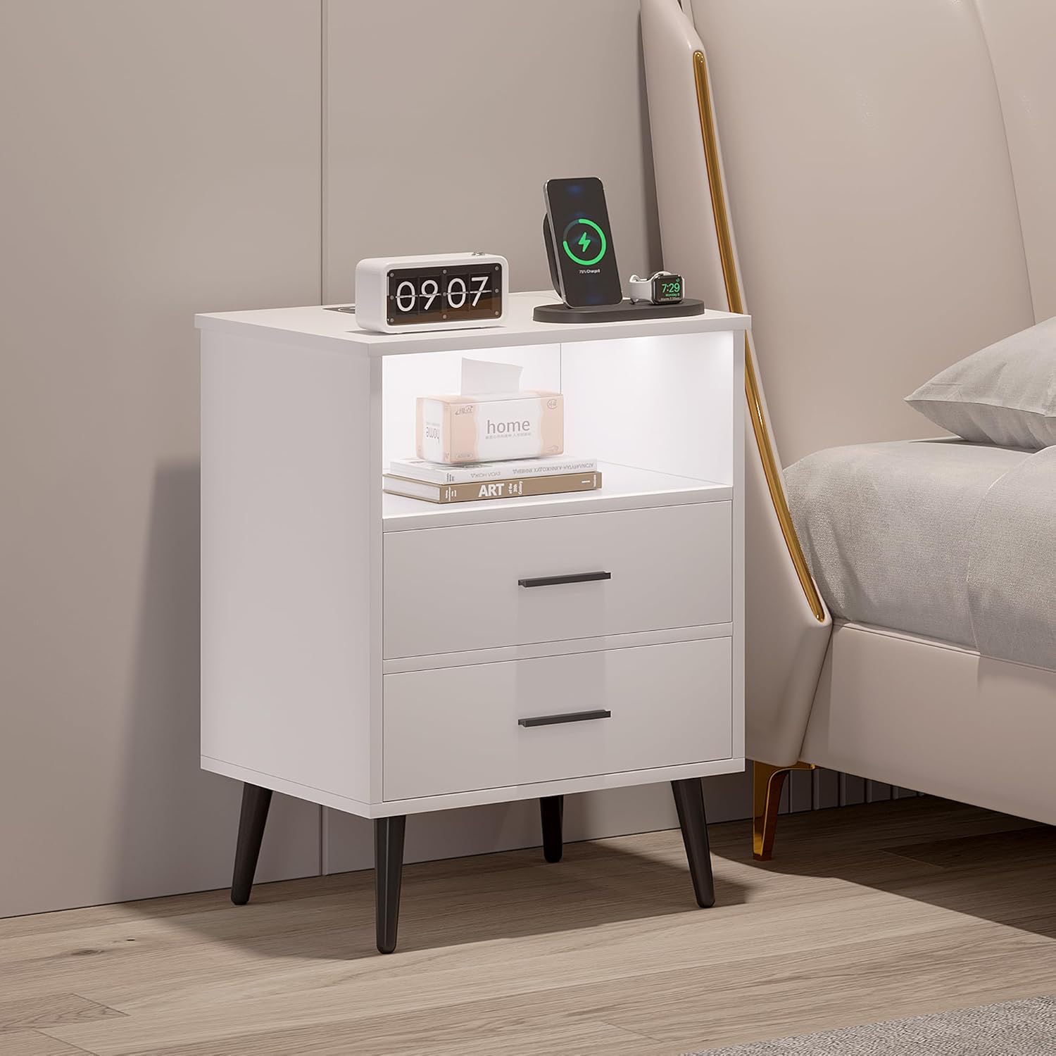 Set of two modern white nightstands with LED lighting, black legs, and drawers shown in a bedroom and perfect for dorm decor.