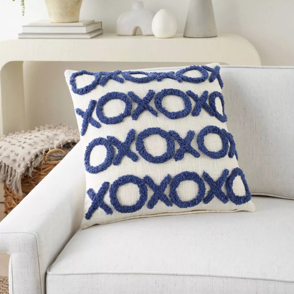 Dorm xoxo throw pillow on couch