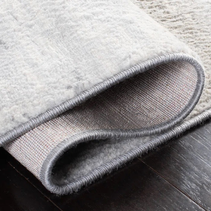 Serene shaded grey rug for dorm decor, side view shown.