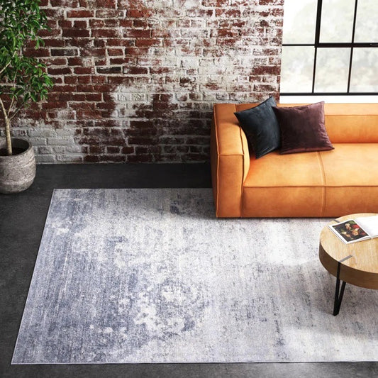 Serene shaded grey rug shown in living space, perfect for dorm decor.