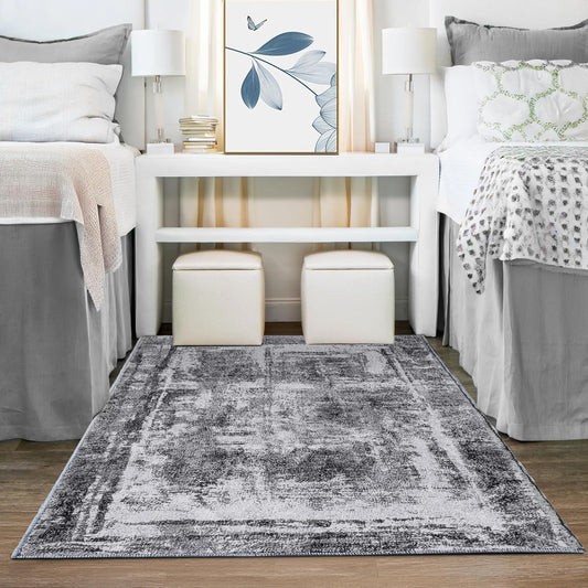 Shades of grey abstract rug in a dorm room setting. 