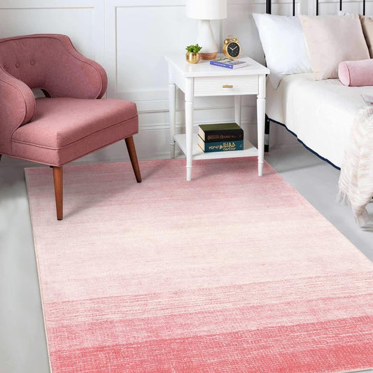 Pink ombré washable rug for a dorm room.
