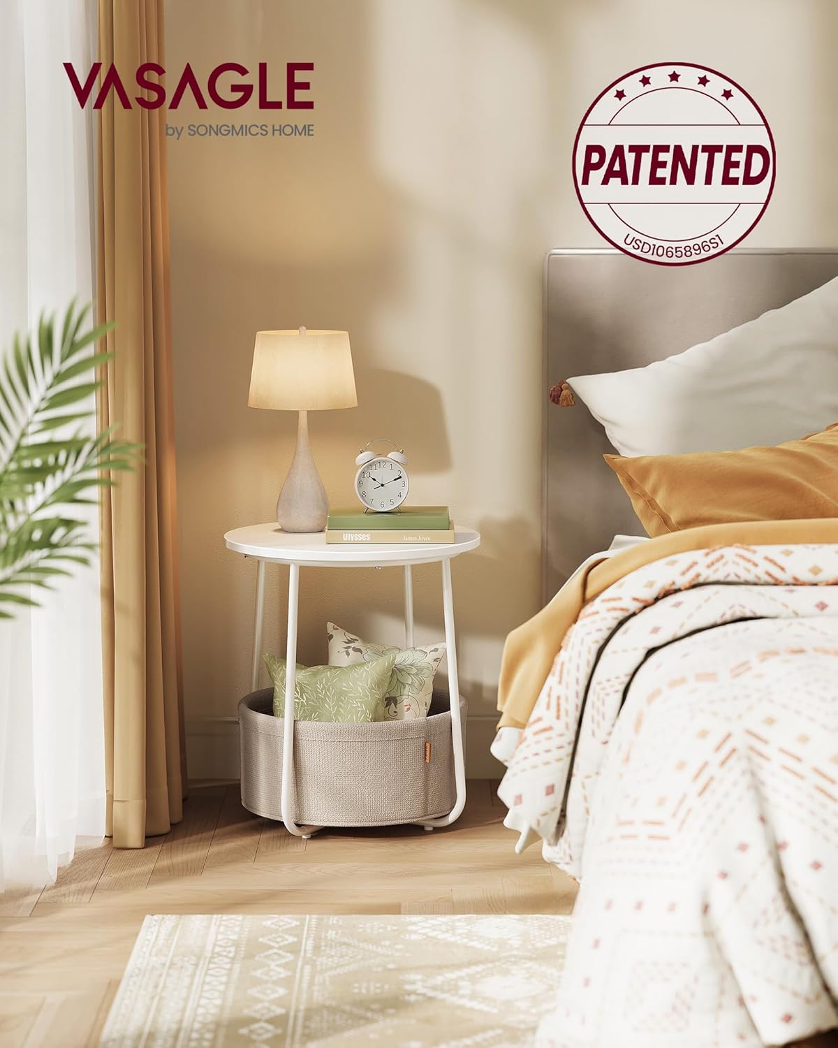 White round bedside table with lower fabric basket shelf for dorm living styled with lamp and books.
