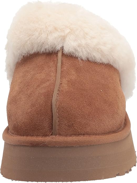 Brown Ugg slipper with white fur lining perfect for dorm or even for class