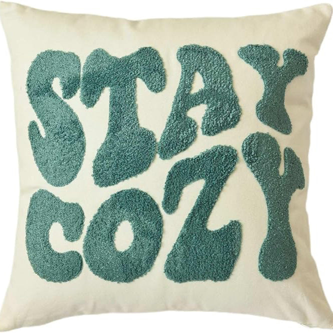Pillow with 'Stay Cozy' text for dorm room