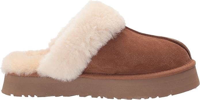 Brown Ugg slipper with white fur lining perfect for dorm or even for class