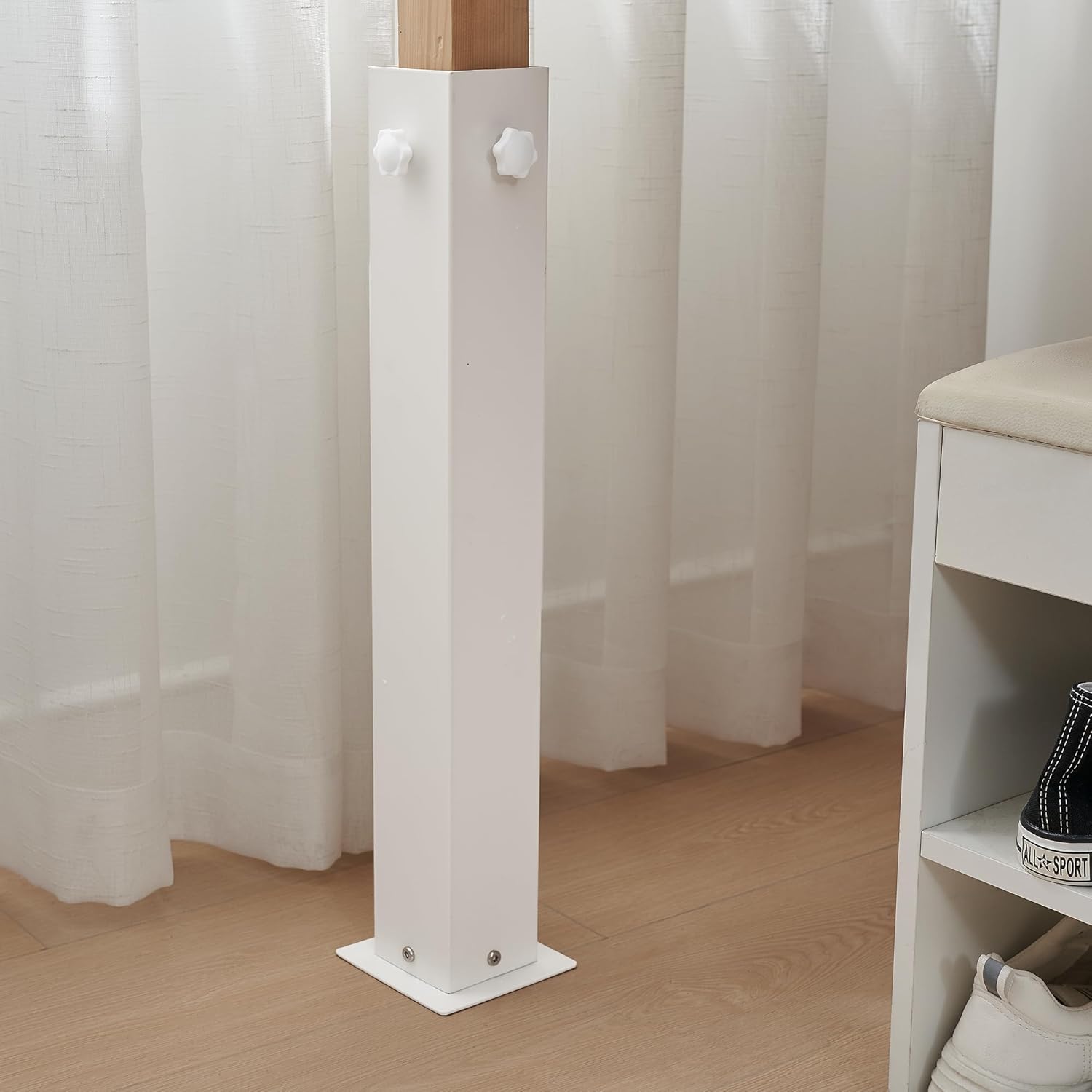 White metal risers for twin XL bed to allow for storage bins and drawers underneath